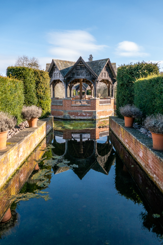 Pavilion with blue sky and reflection in water
