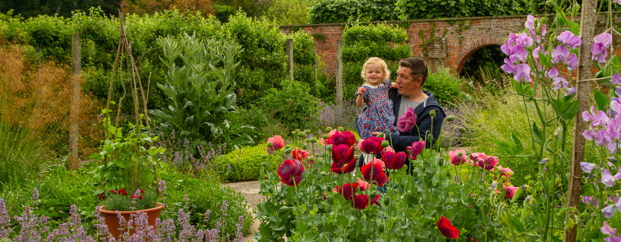 Father and daughter explore the gardens