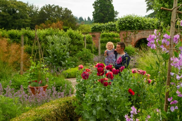 Father and daughter explore the gardens