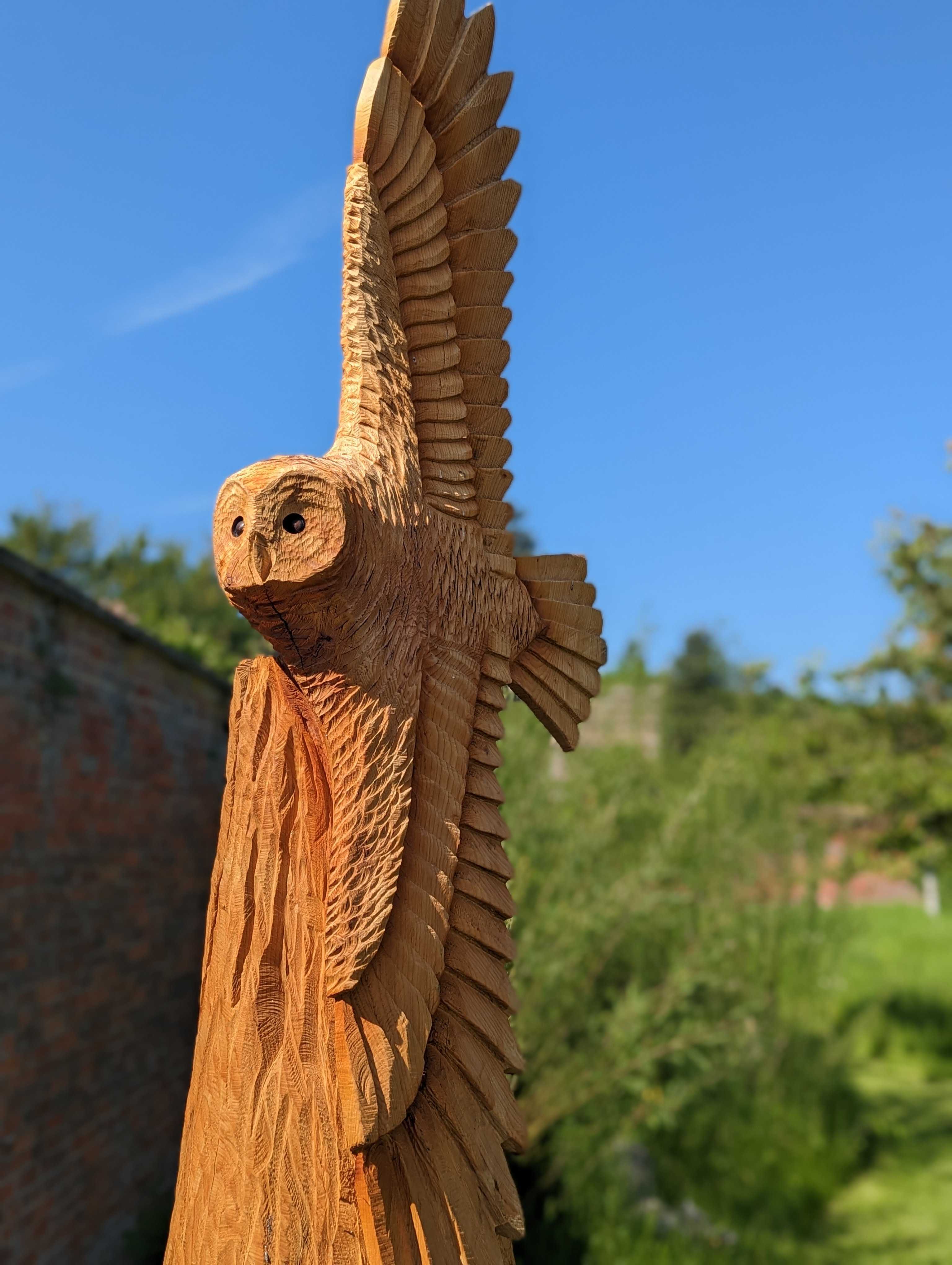 carved-wooden-owl-in-flight