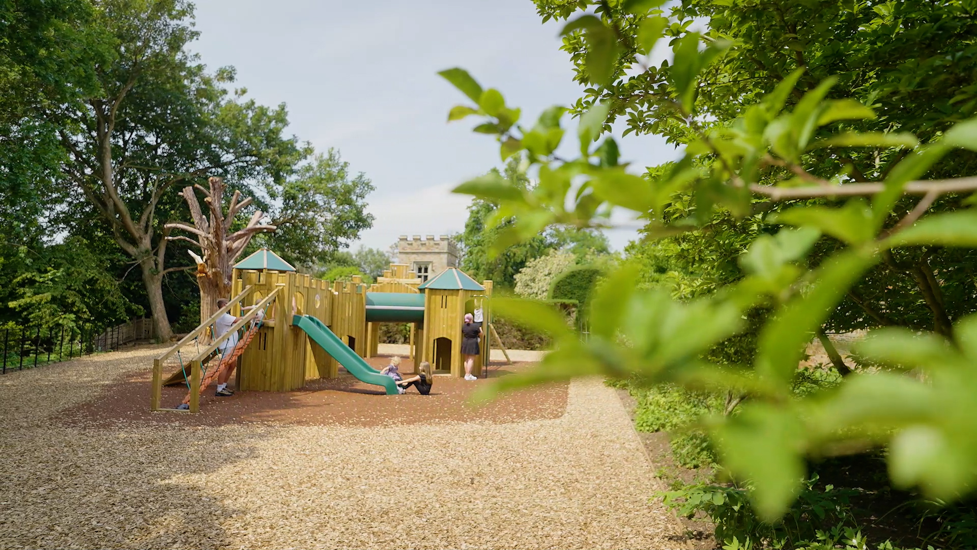 Children-using-castle-themed-play-area 