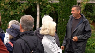 Head Gardener John talking to visitors on a garden tour